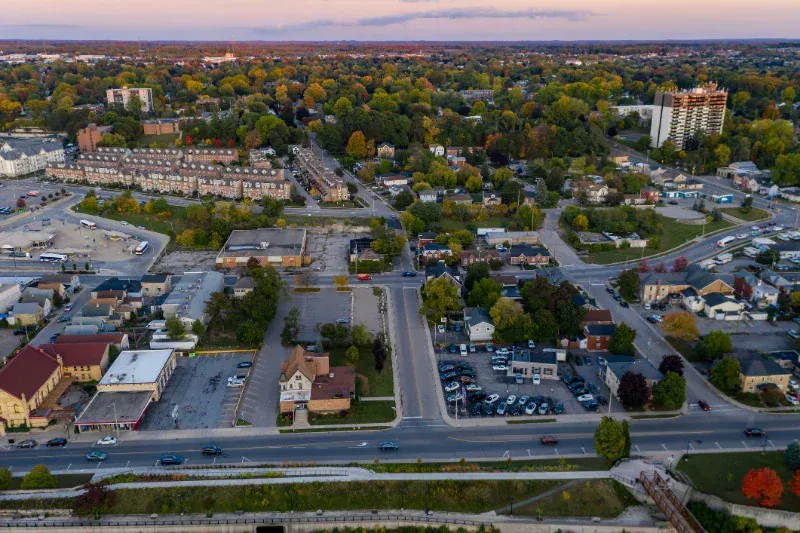 An aerial view of a city with a lot of buildings and trees.