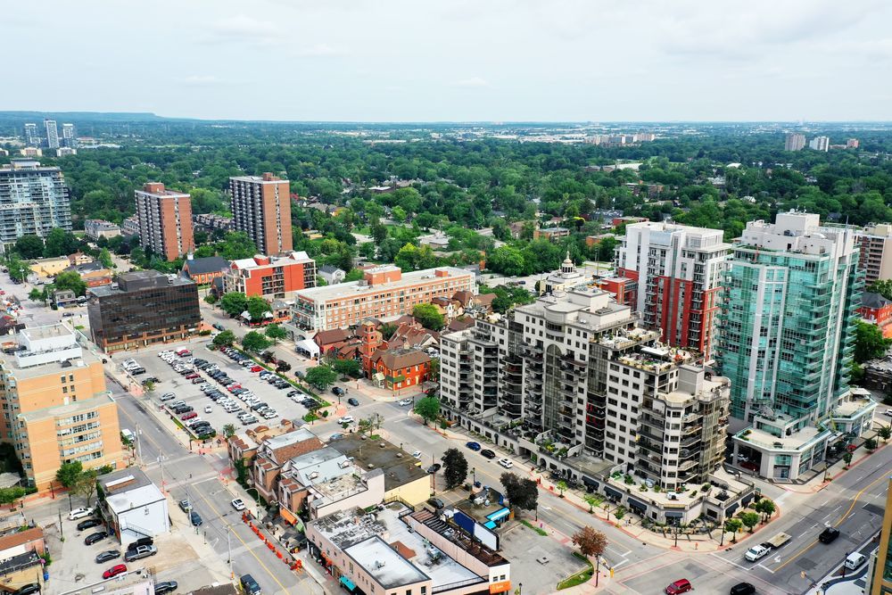 An aerial view of a city with lots of buildings and trees.