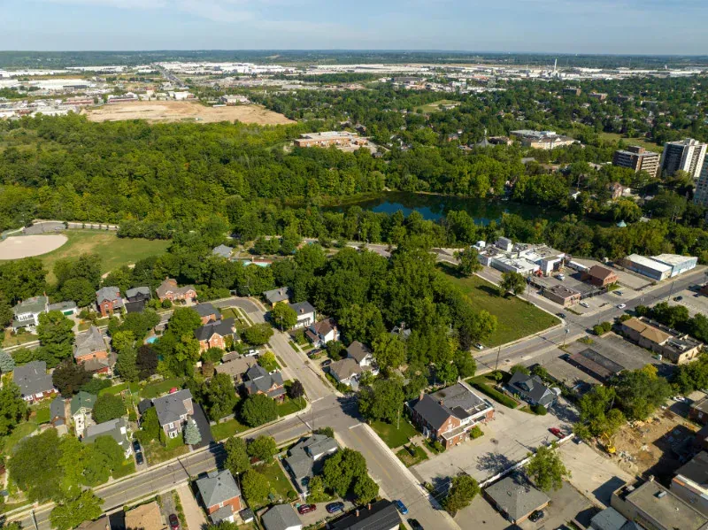 An aerial view of a residential area with lots of trees and houses.