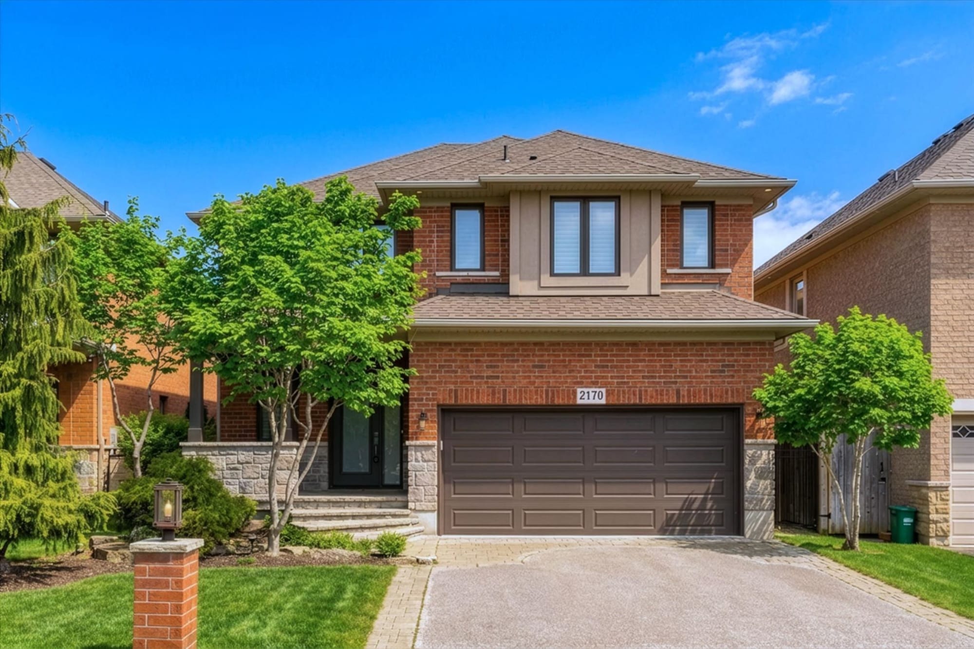 Front exterior of an Oakville estate home, marketed by the Dan Cooper Group.